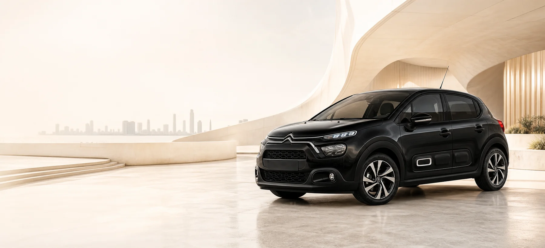 Crni Citroën C3 spreman za najam ispred moderne arhitekture